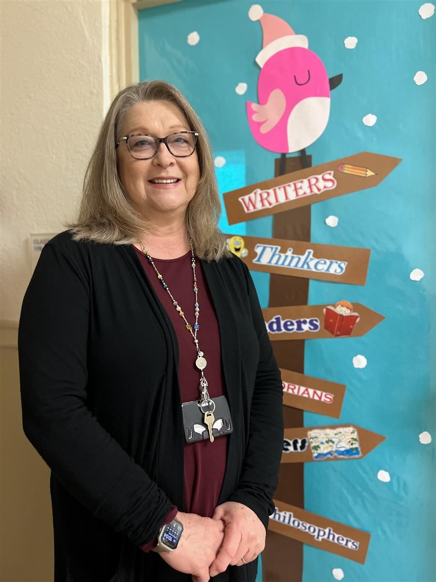 Ms. Mattox smiles to camera.